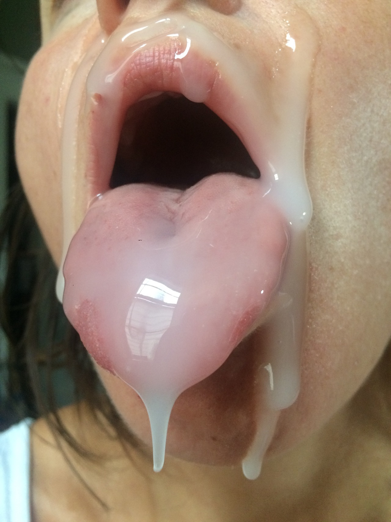 impressive jizz fountain facial cumshot, throat open and tongue out, praying for more jizz.