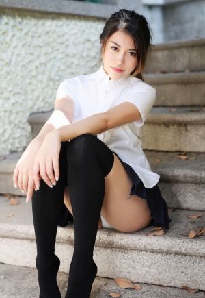 Pic - Nice Chinese Sitting On The Steps And Providing Us A Peek At Her Undies